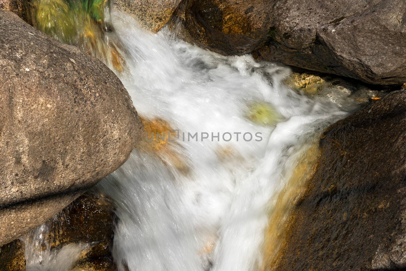 Detail of water flowing over the rocks. Long time exposure