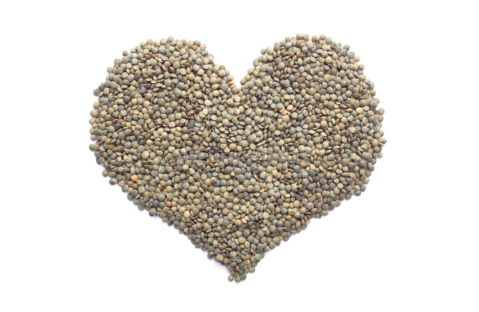 Marbled dark green lentils in a heart shape, isolated on a white background