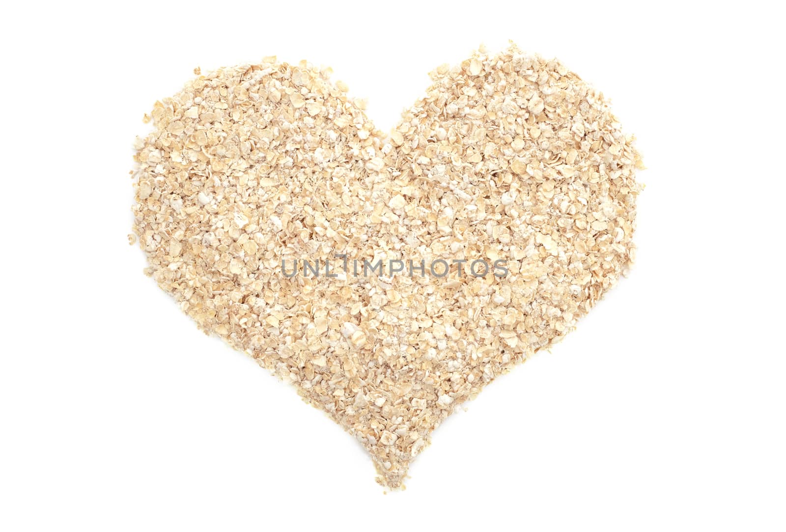 Porridge oats in a heart shape, isolated on a white background