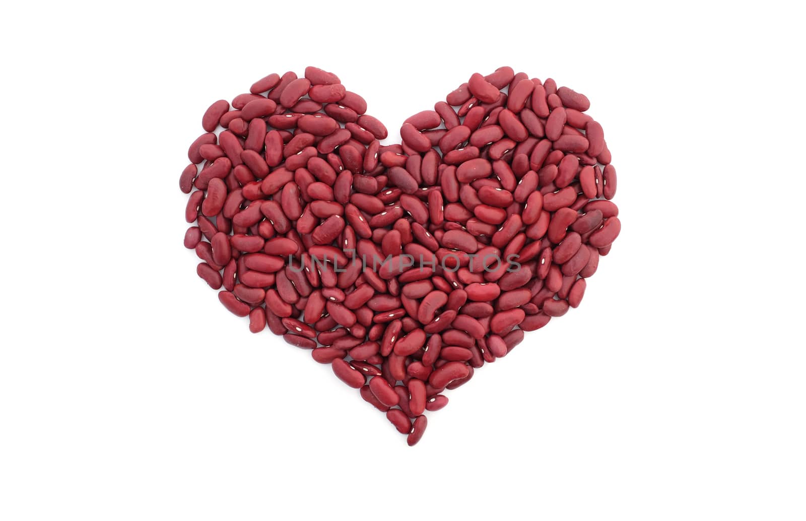 Red kidney beans in a heart shape, isolated on a white background