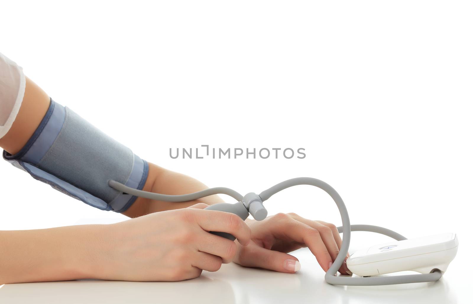 Woman measuring blood pressure, isolated on white