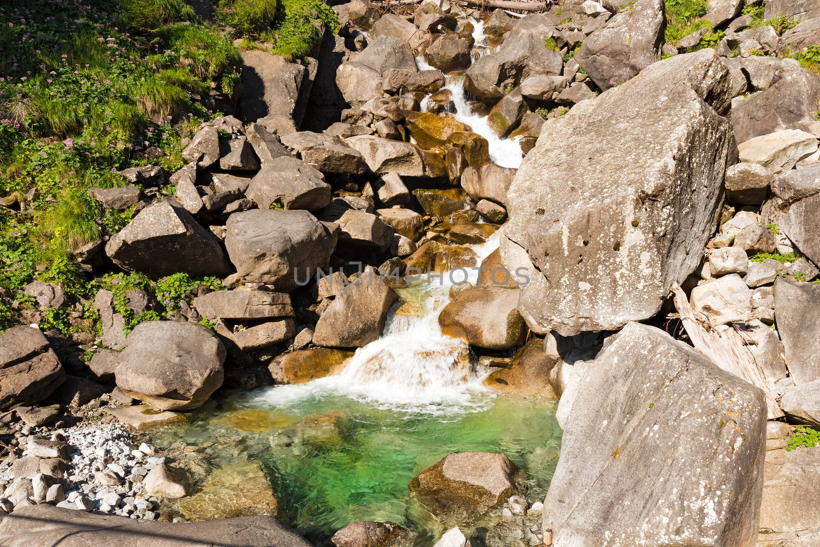 Detail of water flowing over the rocks. Long time exposure