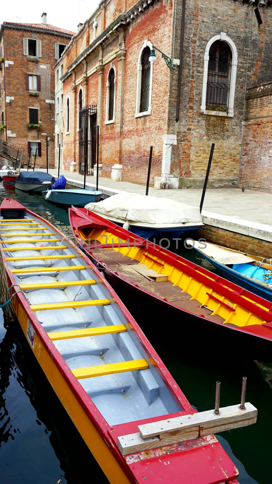colorful boats transportation with Ancient Building in Venice Canal, Italy