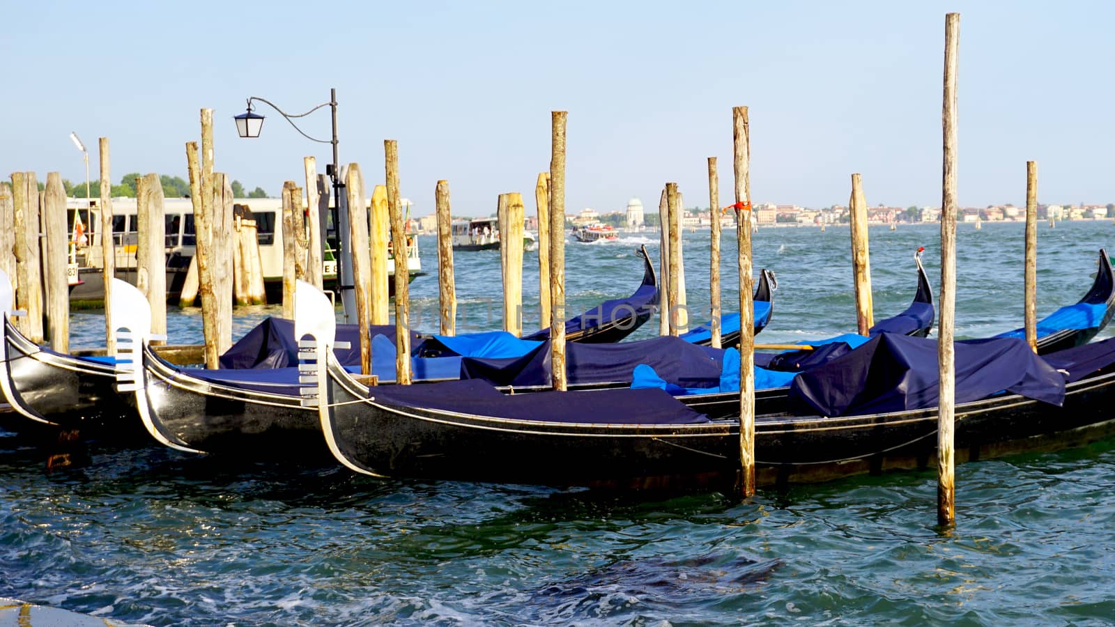 gondola boats floating in the sea in Venice, Italy