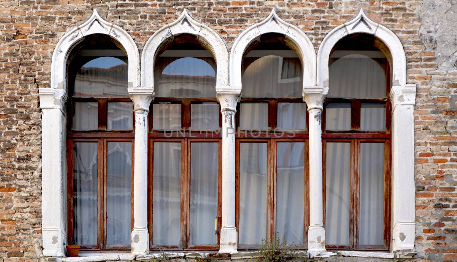 Window and brick wall building architecture, Venice, Italy