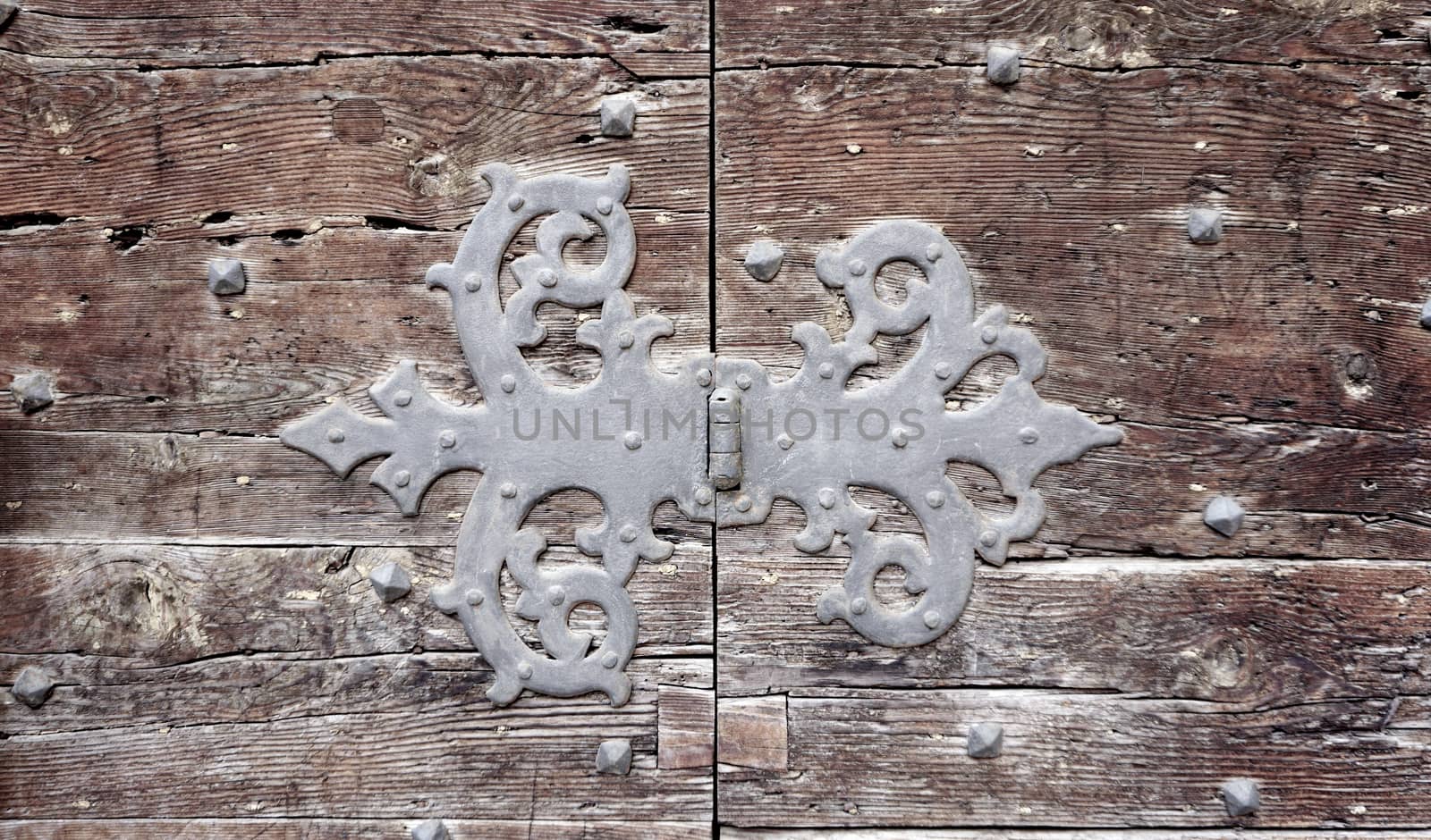 door hinge fitting (flap) art of old wooden door in Venice, Italy