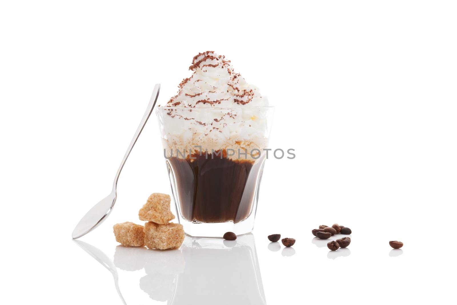 Viennese coffee. Espressoo coffe toped with whipped cream and sprinkled with chocolated with coffee beans, brown sugar and spoon isolated on white background.