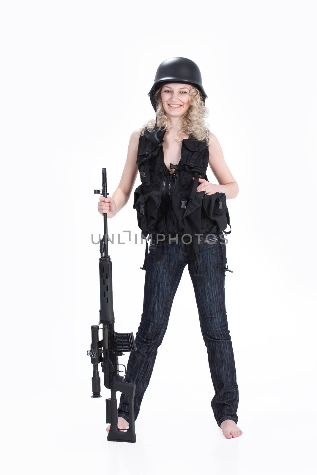 Young blonde woman dressed in military style with weapon