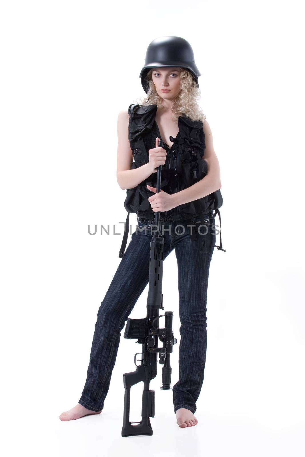 Young blonde woman dressed in military style with weapon