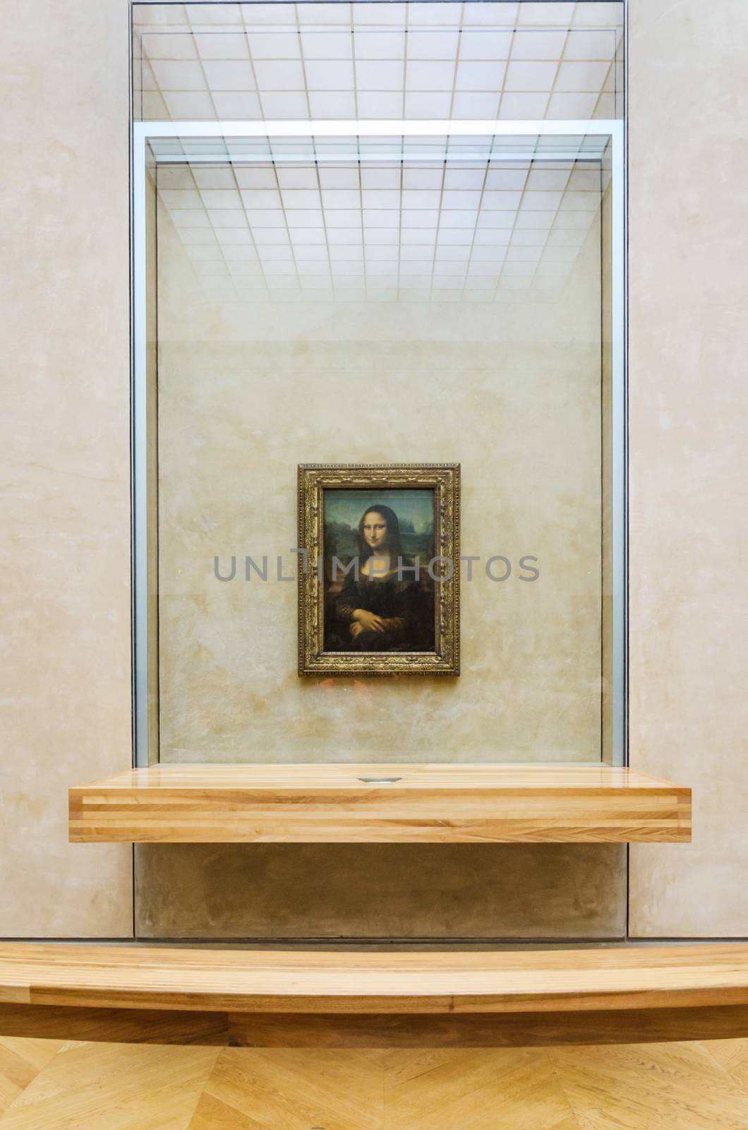 Paris, France - May 13, 2015: Leonardo DaVinci's "Mona Lisa" at the Louvre Museum, May 13, 2015 in Paris, France. The painting is one of the world's most famous.