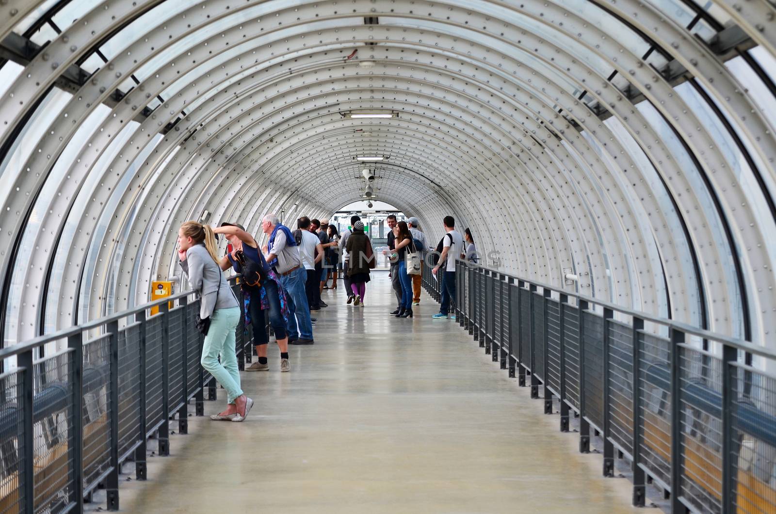 Paris, France - May 13, 2015: People visit Glass tube corridor  at Pompidou Centre by siraanamwong