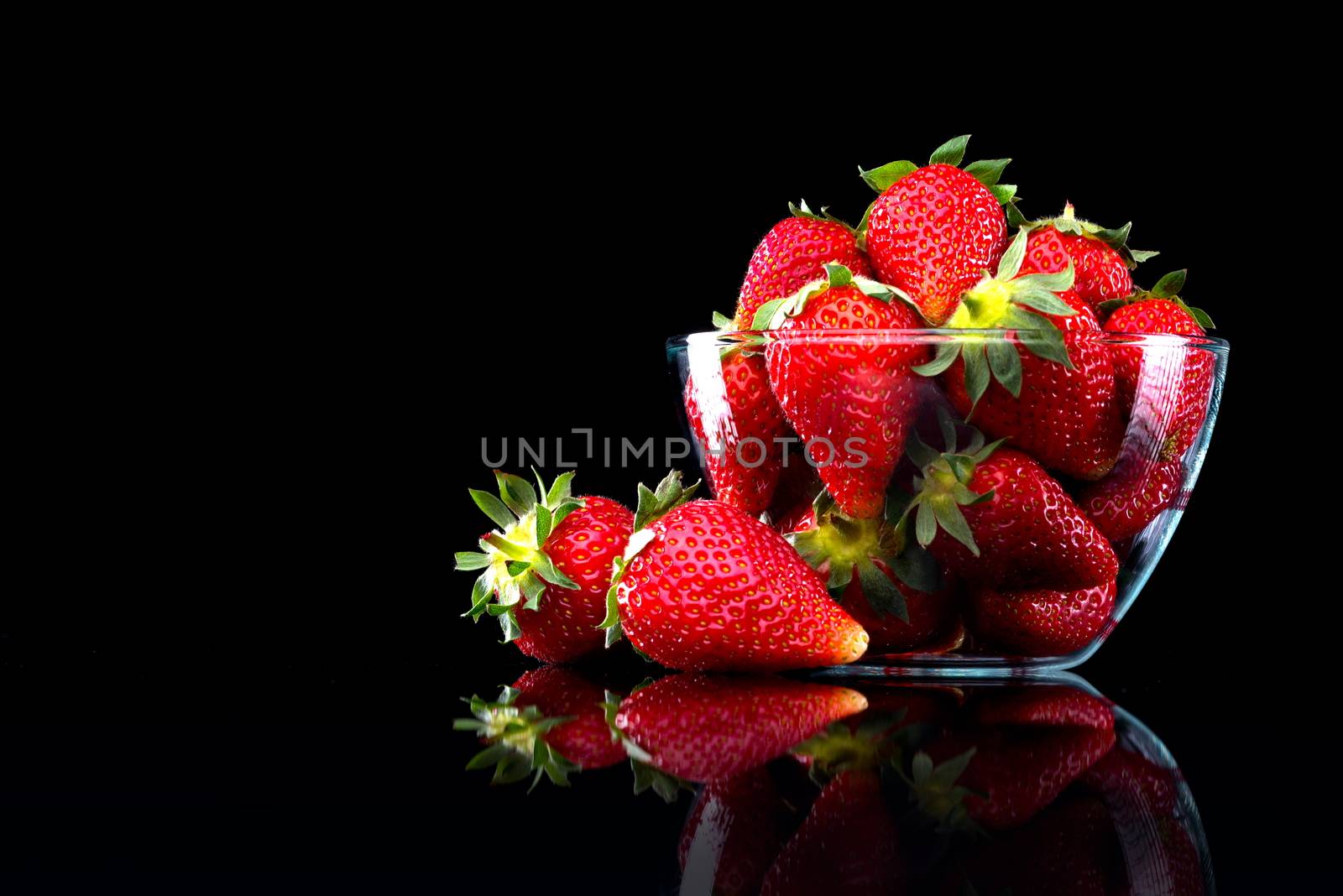Delicious strawberries in a bowl by stokkete