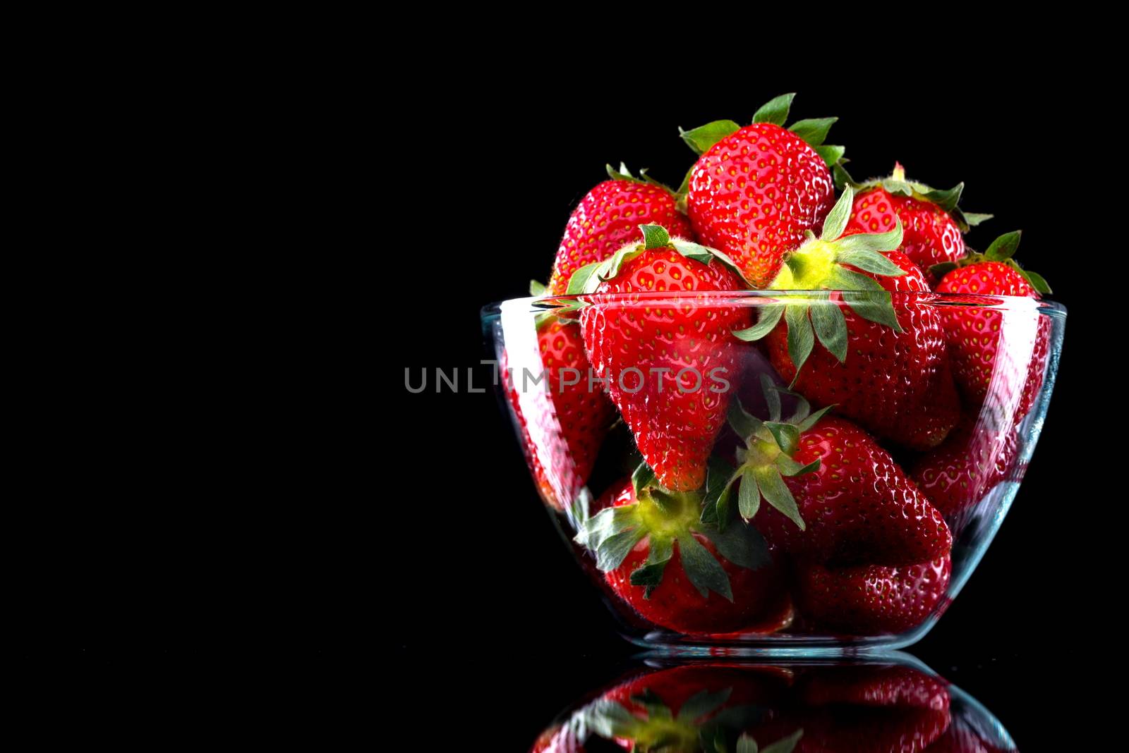 Delicious strawberries in a bowl by stokkete