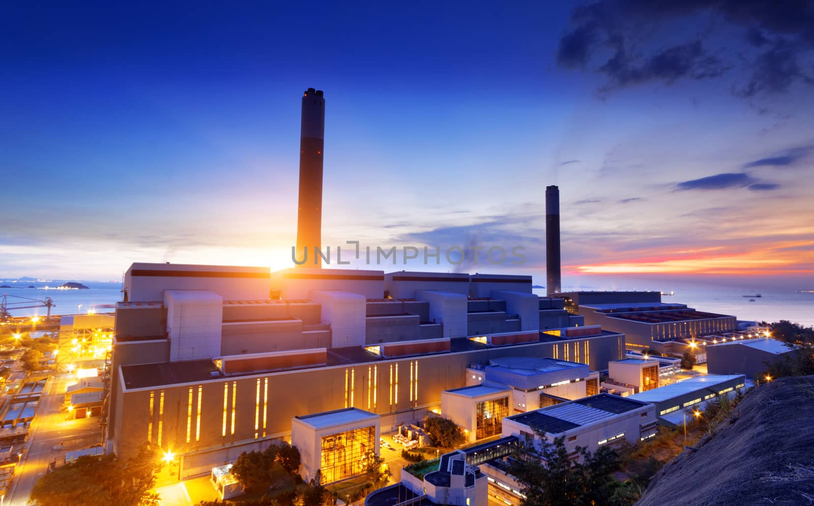 Glow light of petrochemical industry on sunset