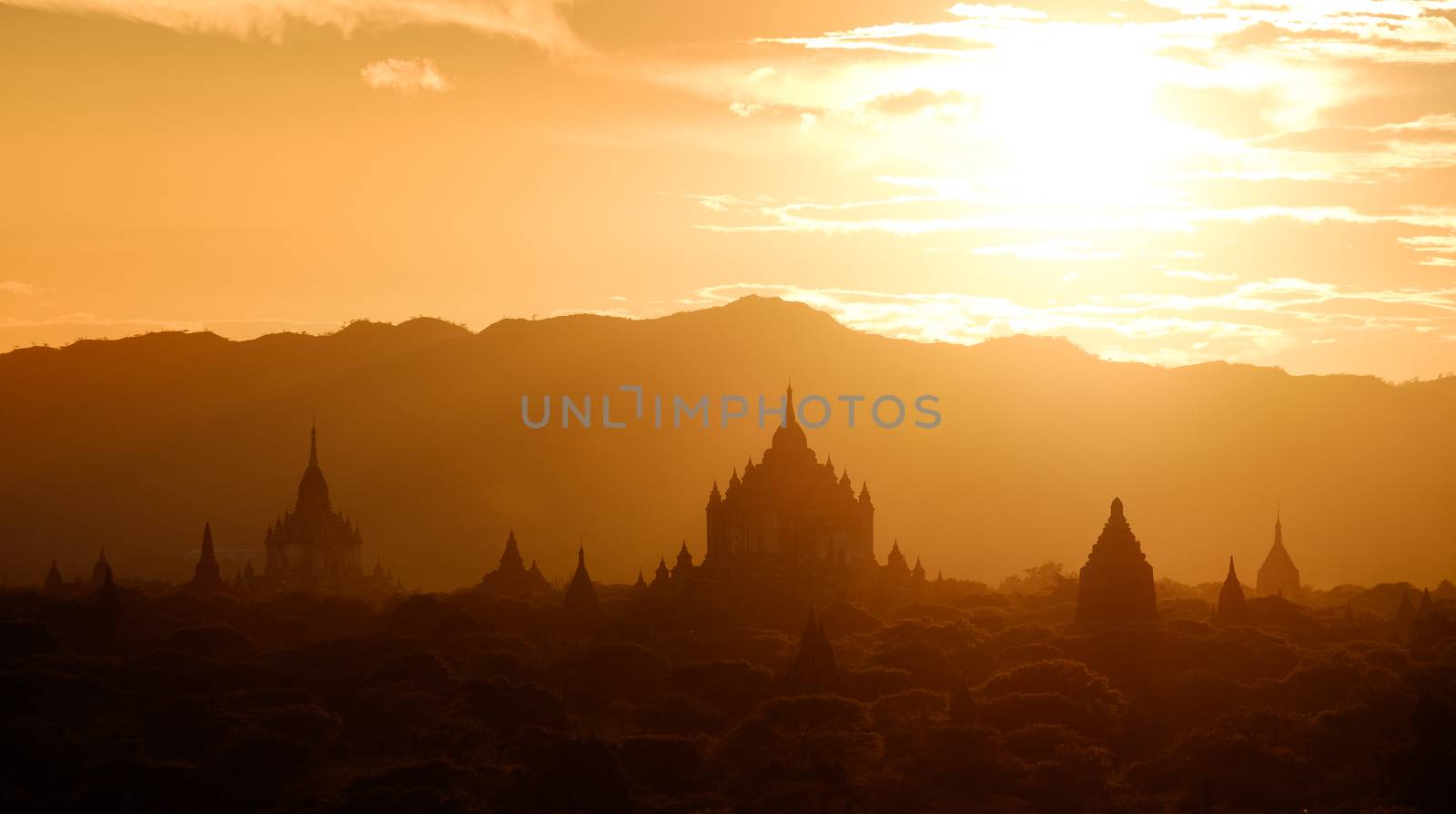 Panoramic landscape view of golden sunset in Bagan, Myanmar by martinm303