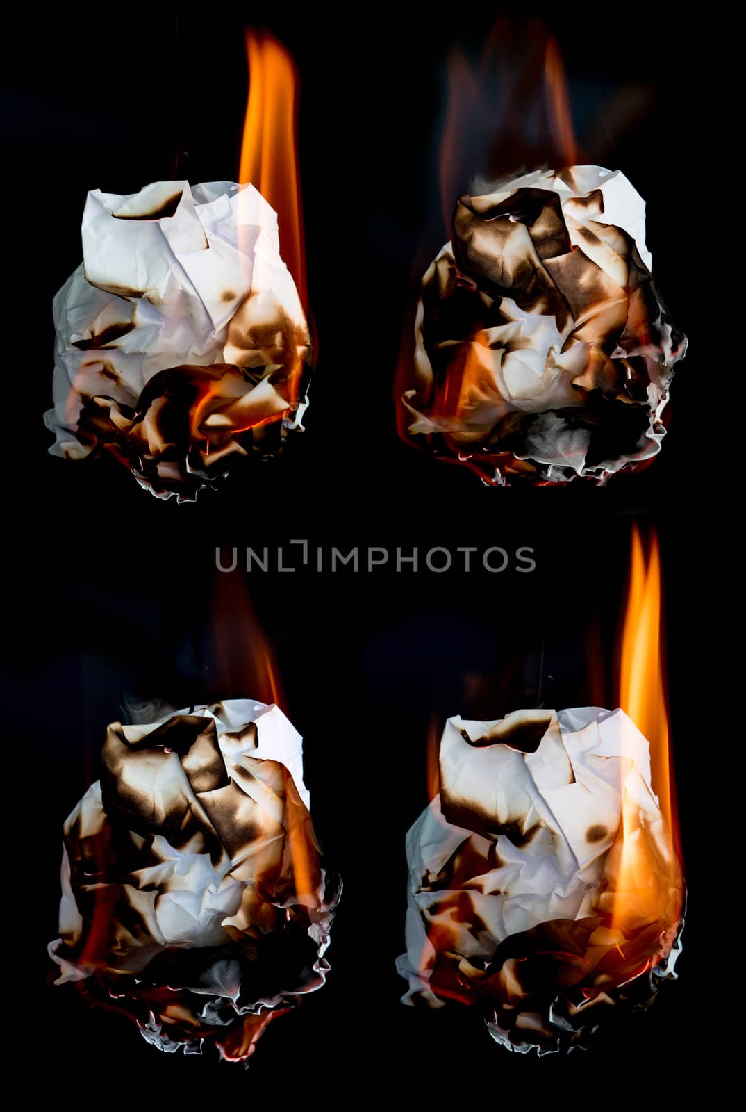 paper burning on black background by anankkml