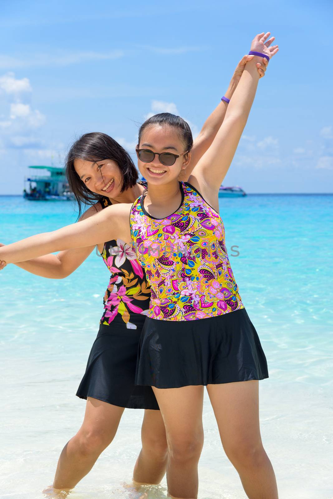 Mother and daughter on the beach at Similan islands, Thailand by Yongkiet