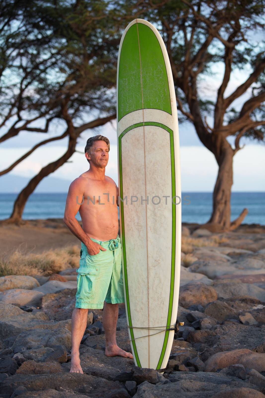 Surfer Posing with Surfboard by Creatista
