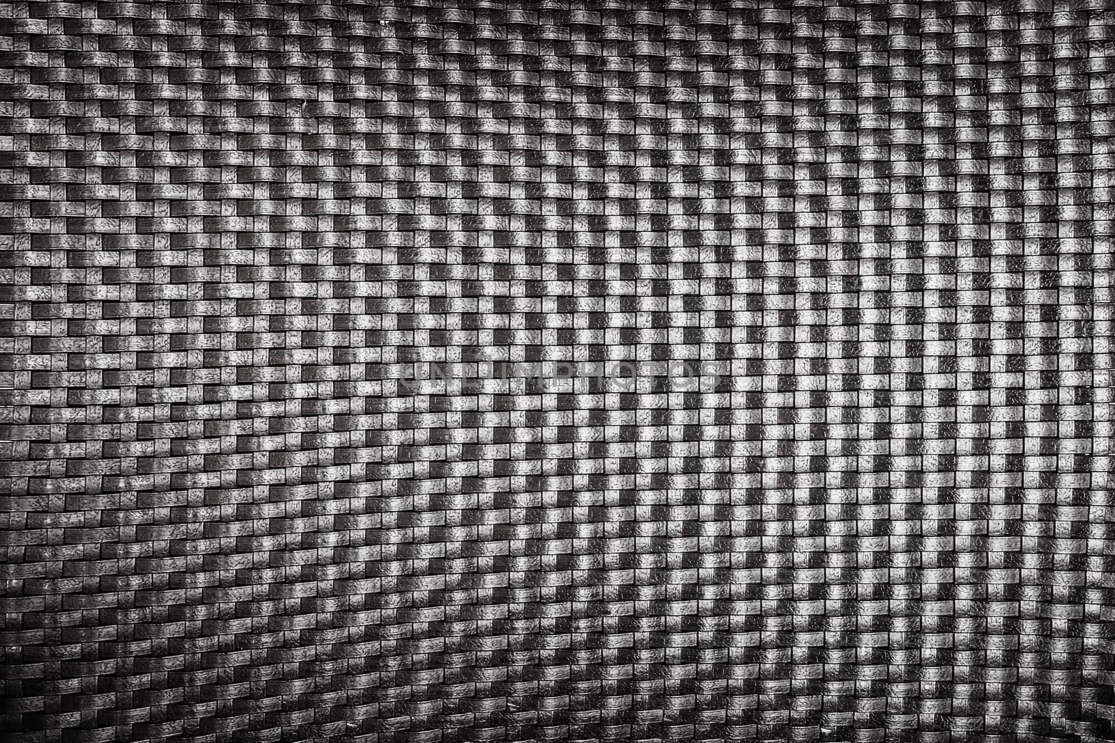 plastic woven wicker pattern, black color background texture