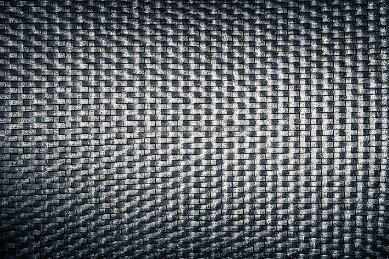 plastic woven wicker pattern, black color background texture