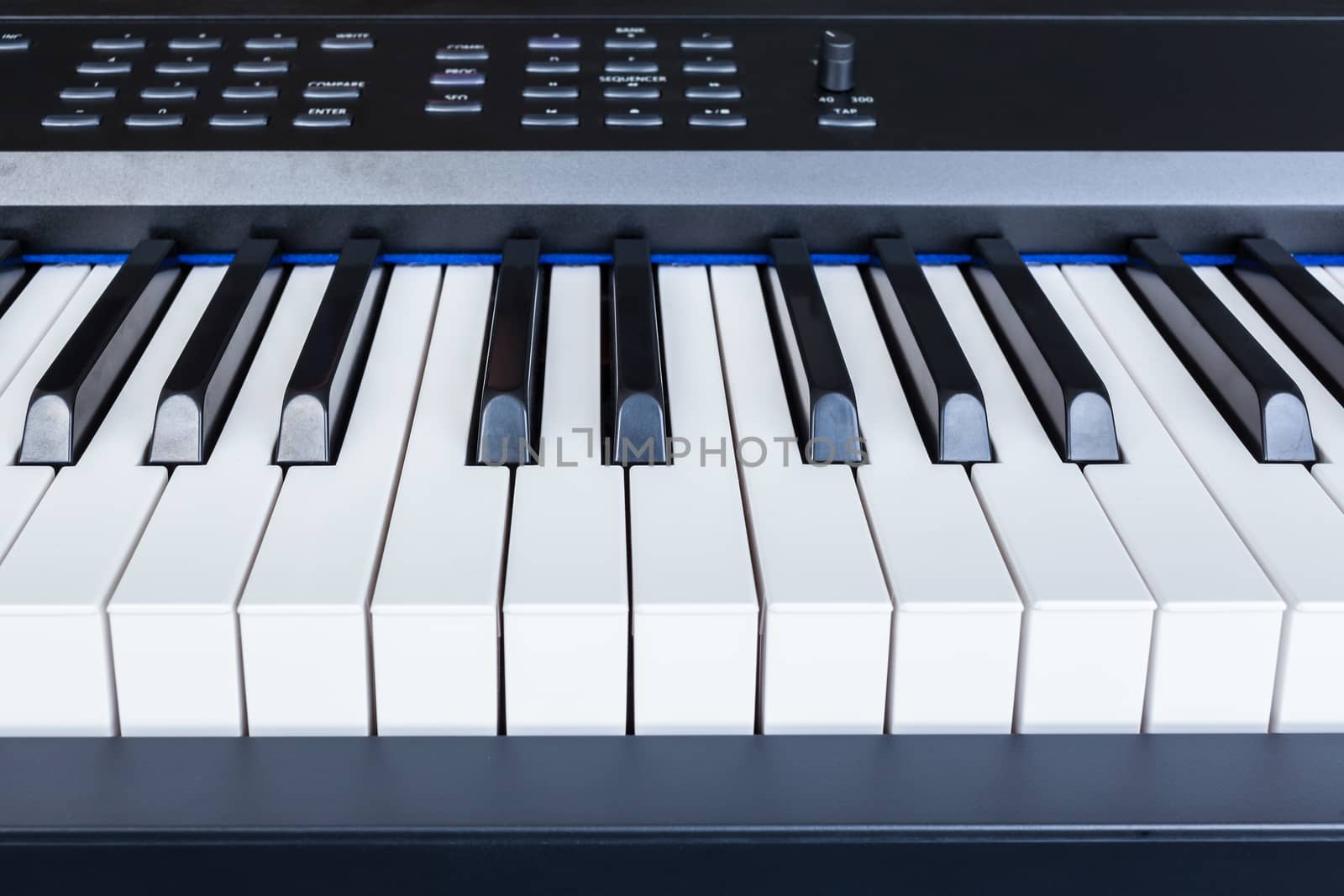 Piano Keyboard synthesizer closeup key frontal view