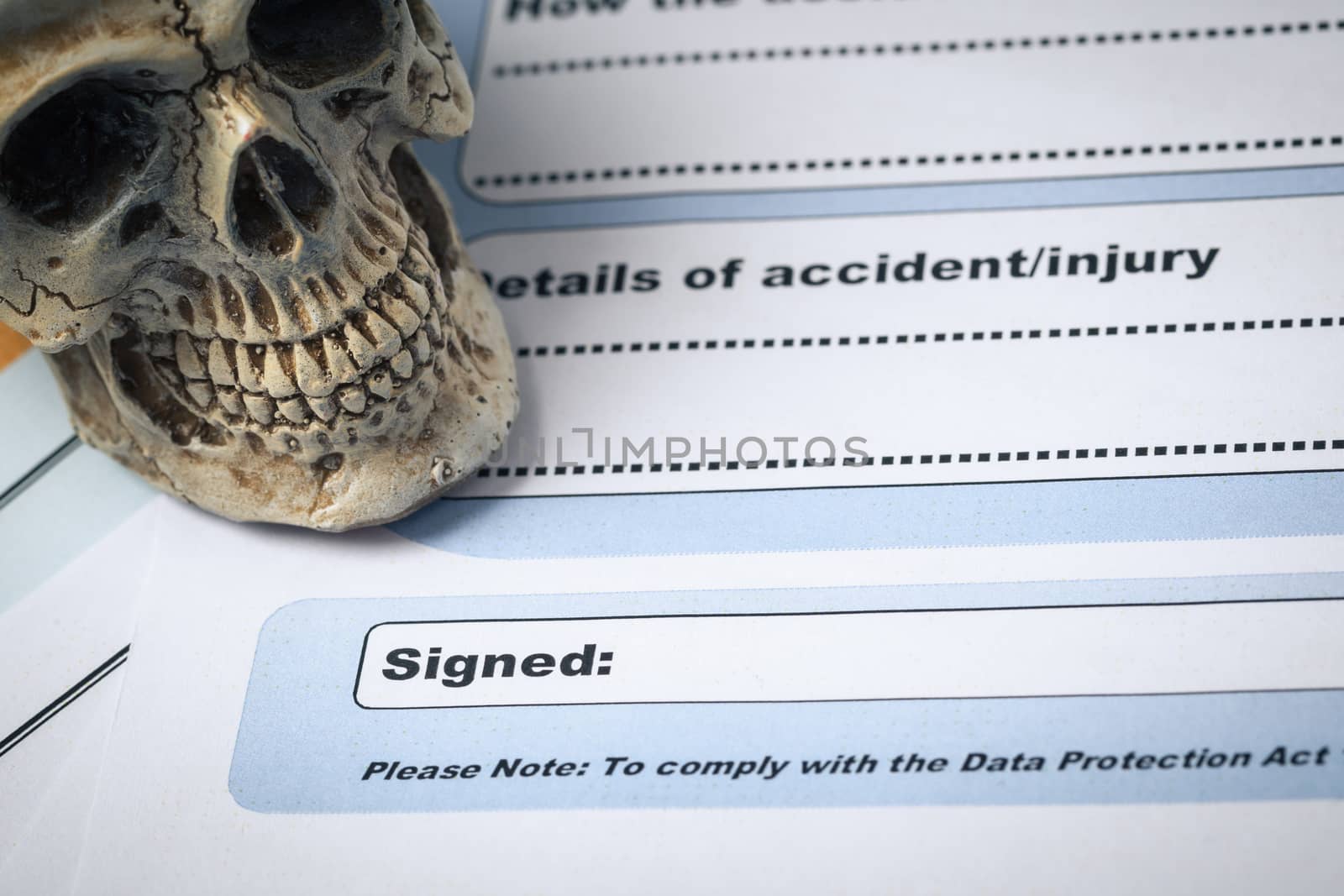 Signature field on document with pen and skull signed here; document is mock-up