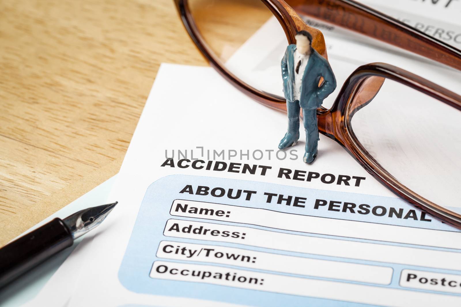 Accident report application form and businessman with pen and ey by FrameAngel