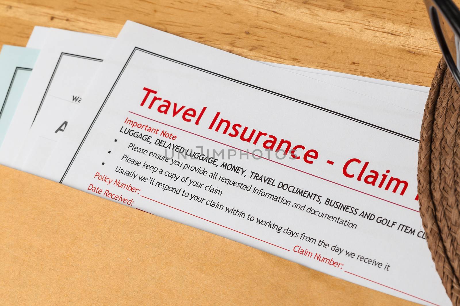 Travel Insurance Claim application form and hat with eyeglass on by FrameAngel