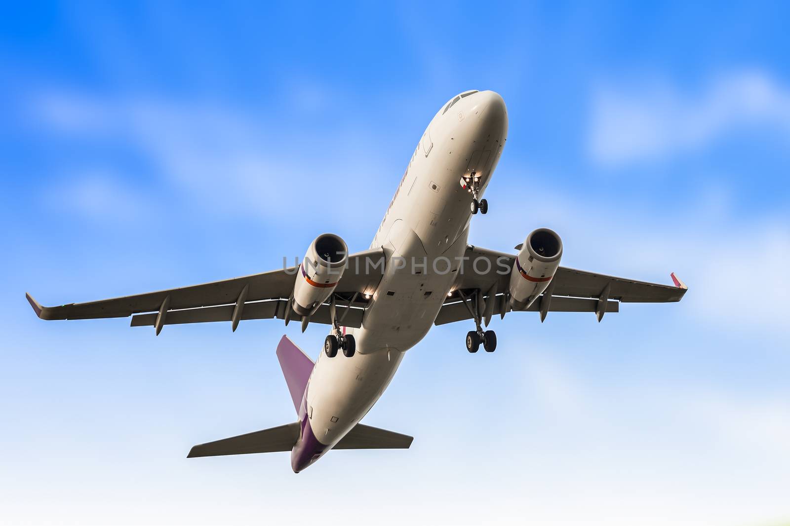 Passenger business airplane take off and flying in blue sky, use for air transport, journey and travel concept
