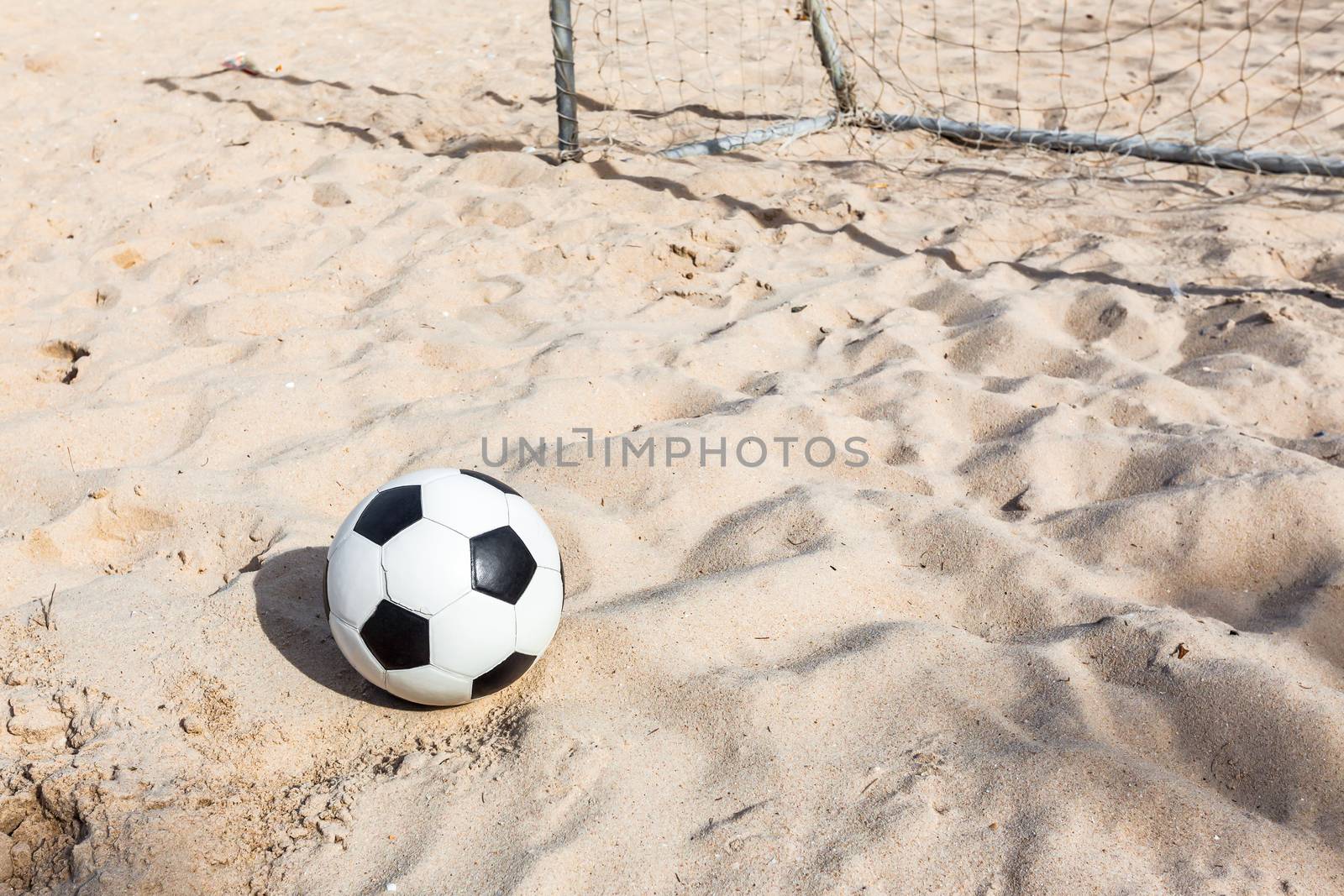 football soccer on sand beach by FrameAngel