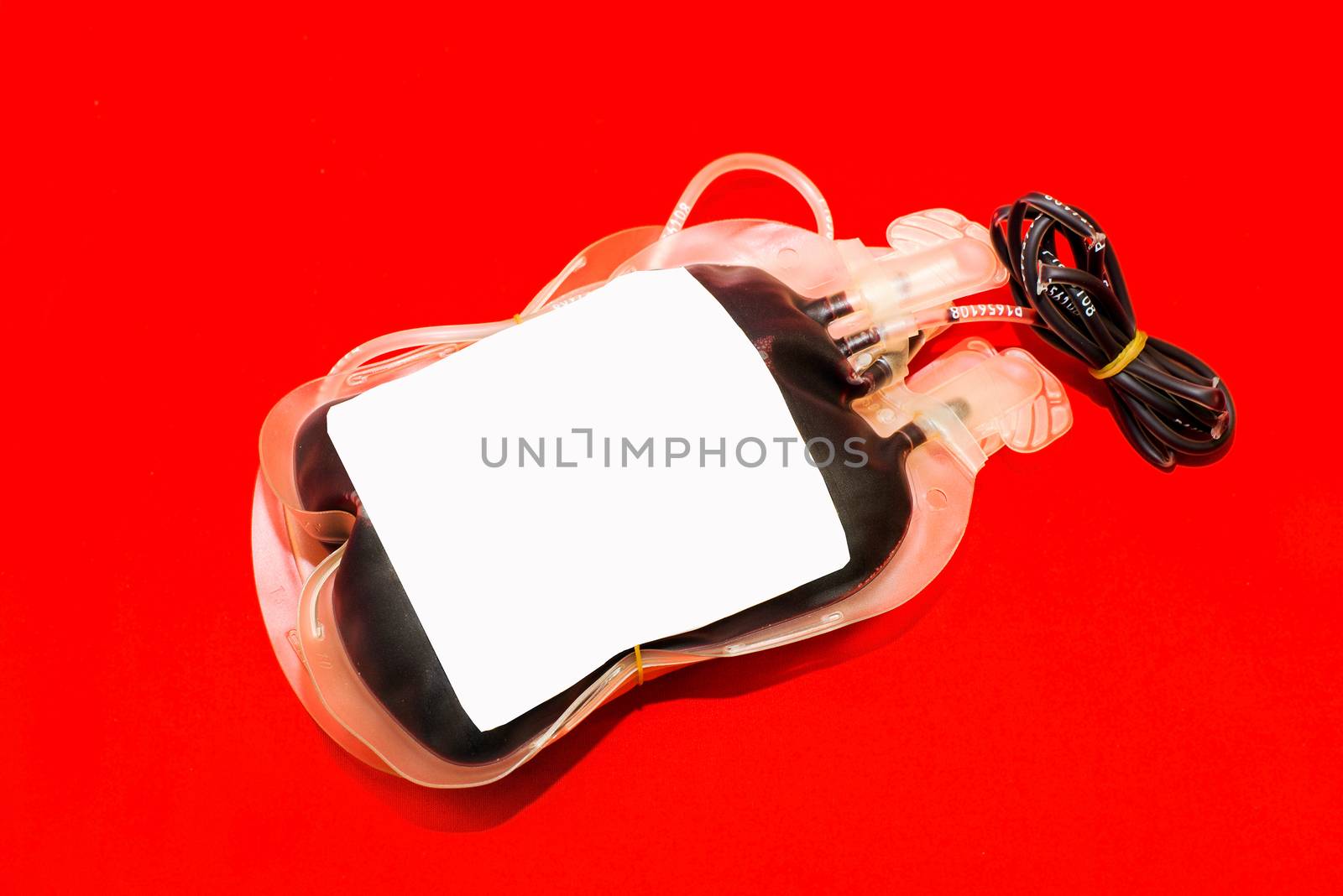 Close up bag of blood and plasma isolated on Red background