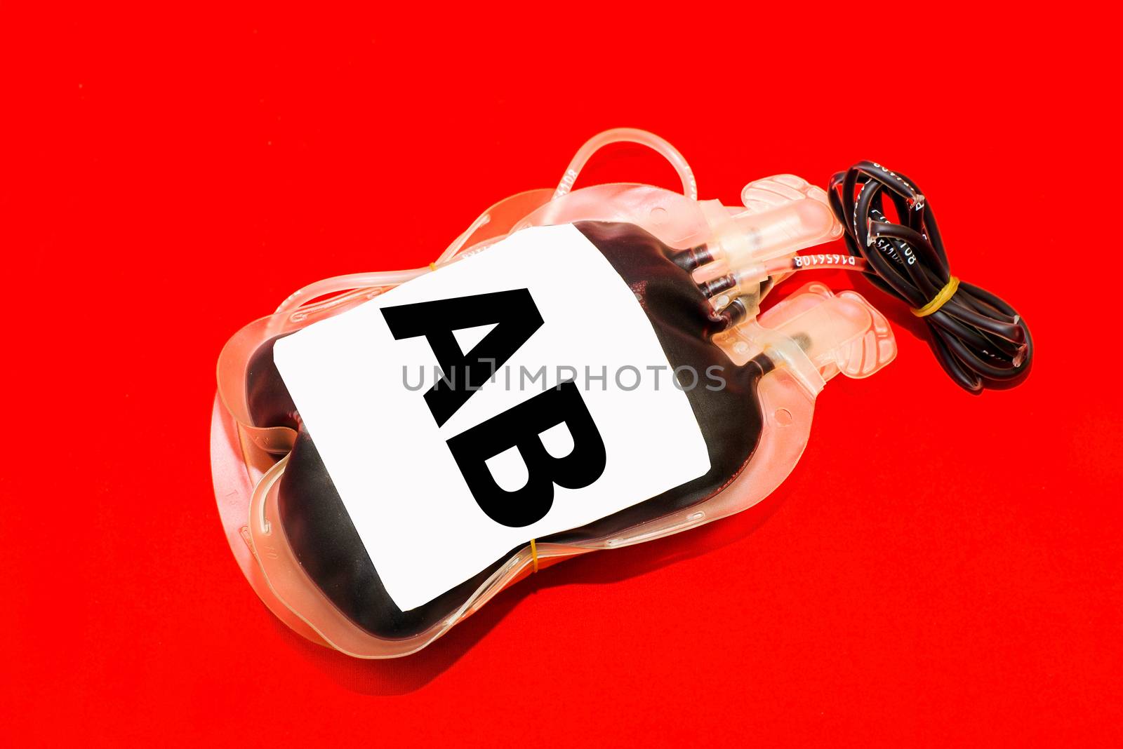 Close up bag of blood and plasma group AB isolated on Red background