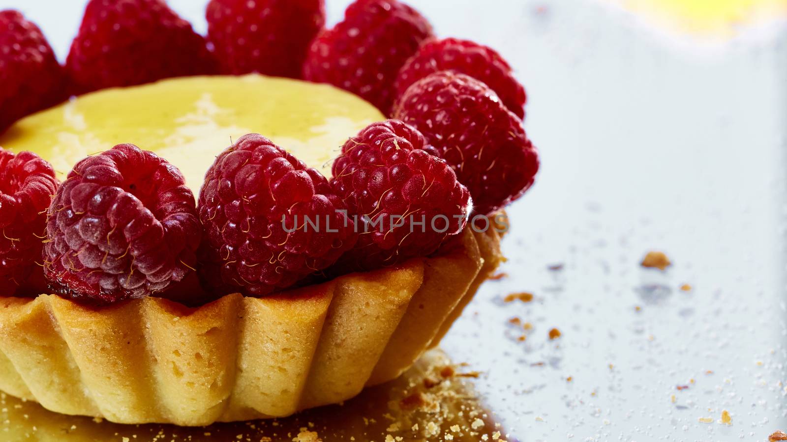 Home made tartlets with raspberries. With copy space