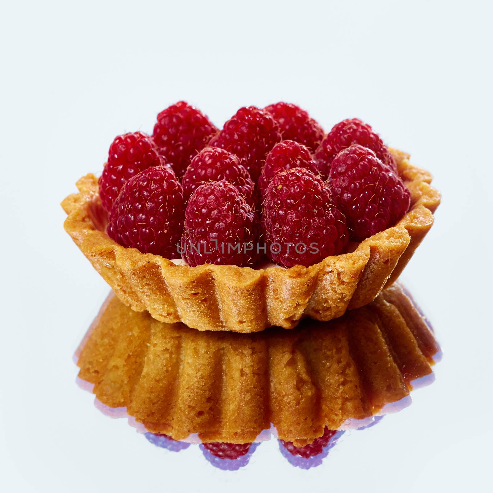 Home made tartlets with raspberries. With copy space