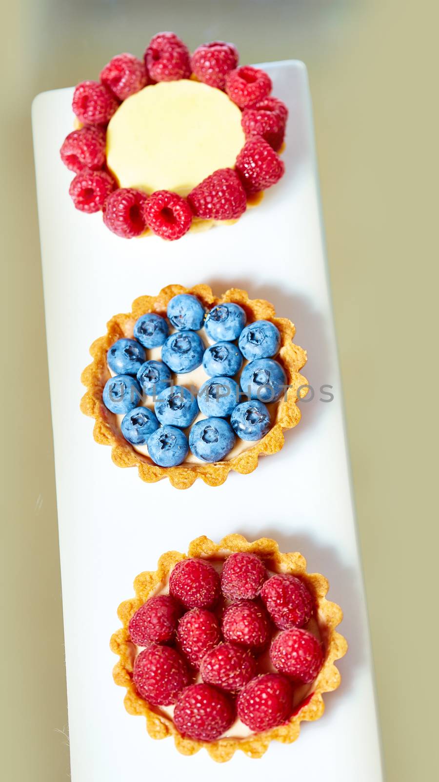 fruit tartlets with raspberries and blueberries  by sarymsakov