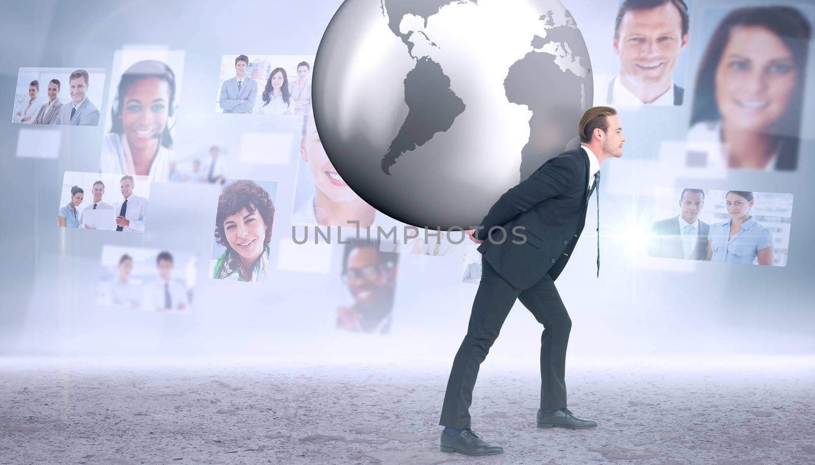 Composite image of businessman carrying the world by Wavebreakmedia