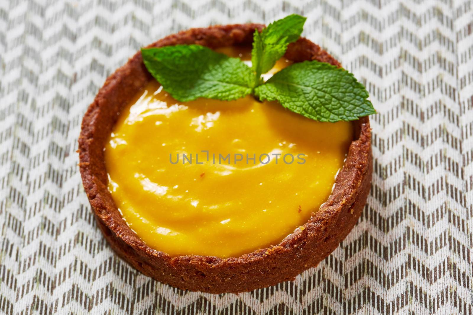 Sweet tartlets filled with cream. With copy space