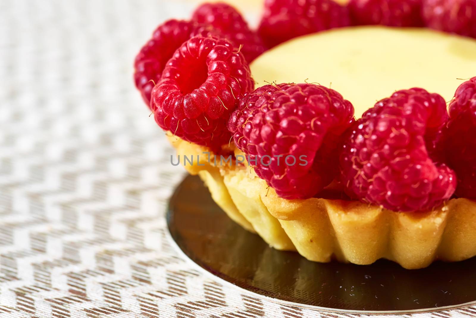 Home made tartlets with raspberries. With copy space