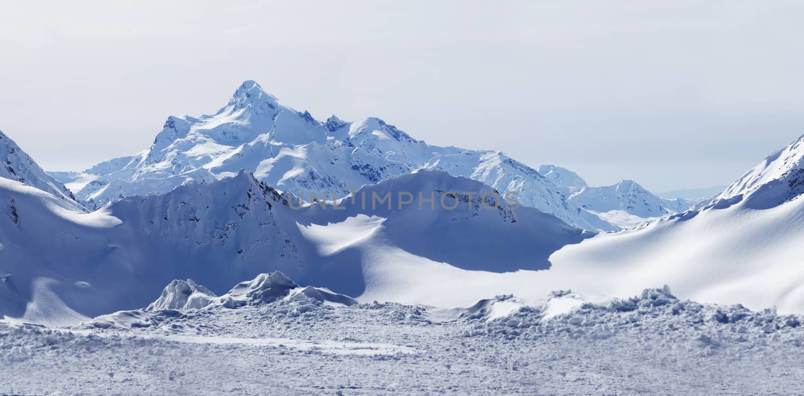 Russia. Caucasus. View on Elbrus Mount - the highest point of Europe from Cheget Mount. Panorama the review from 4 shots