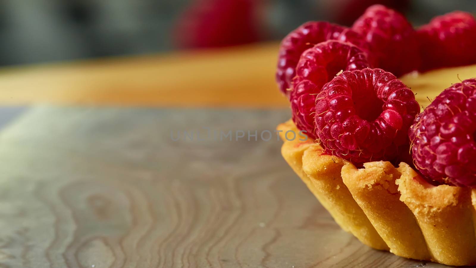 Home made tartlets with raspberries. With copy space