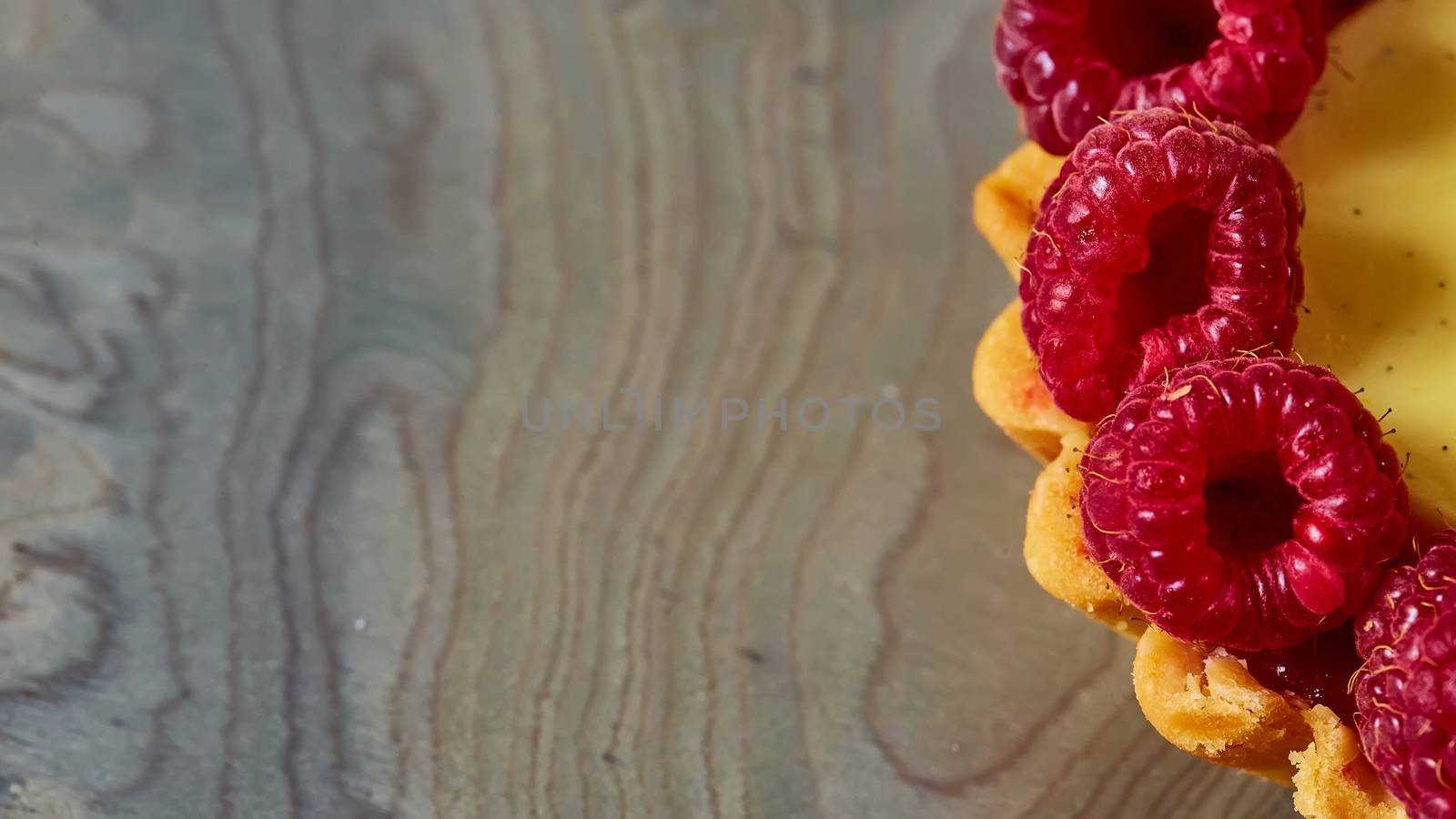 Home made tartlets with raspberries. With copy space