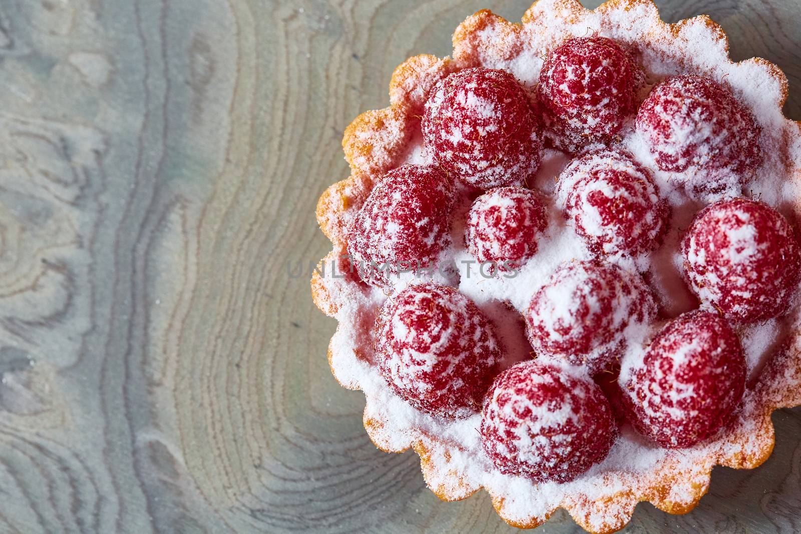 Home made tartlets with raspberries. With copy space