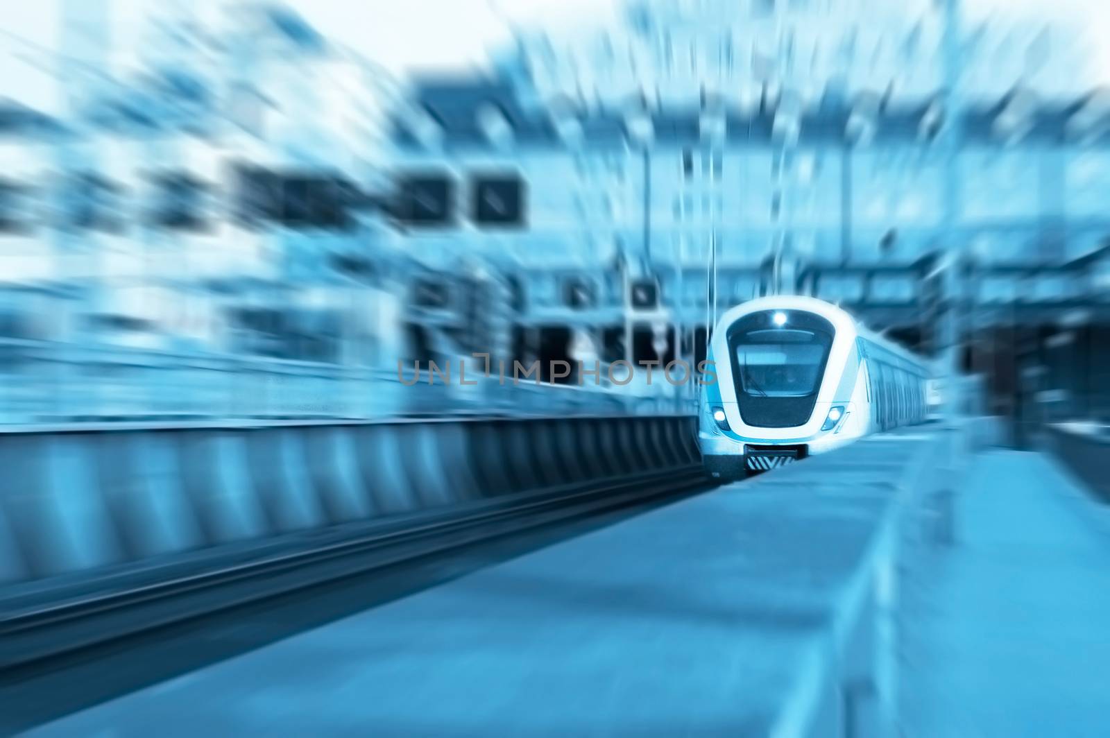 Transportation conceptual image. A speeding train on rails. Motion blur picture.
