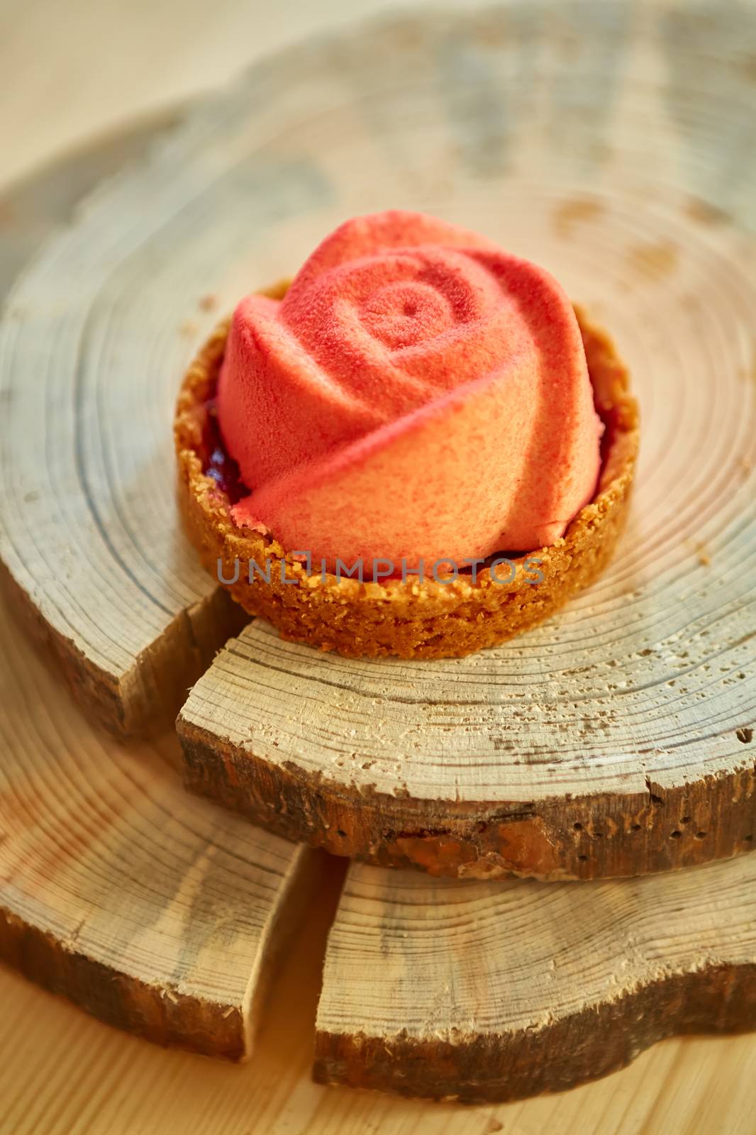 Home made tartlet rose on wooden background. Shallow dof