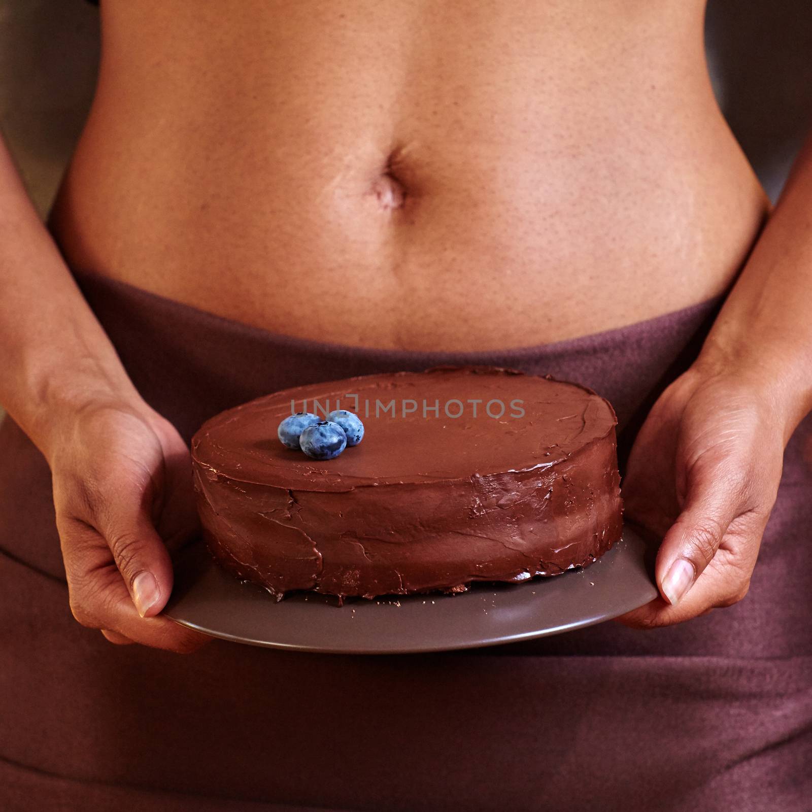 Dessert in hand at level of the abdomen. by sarymsakov
