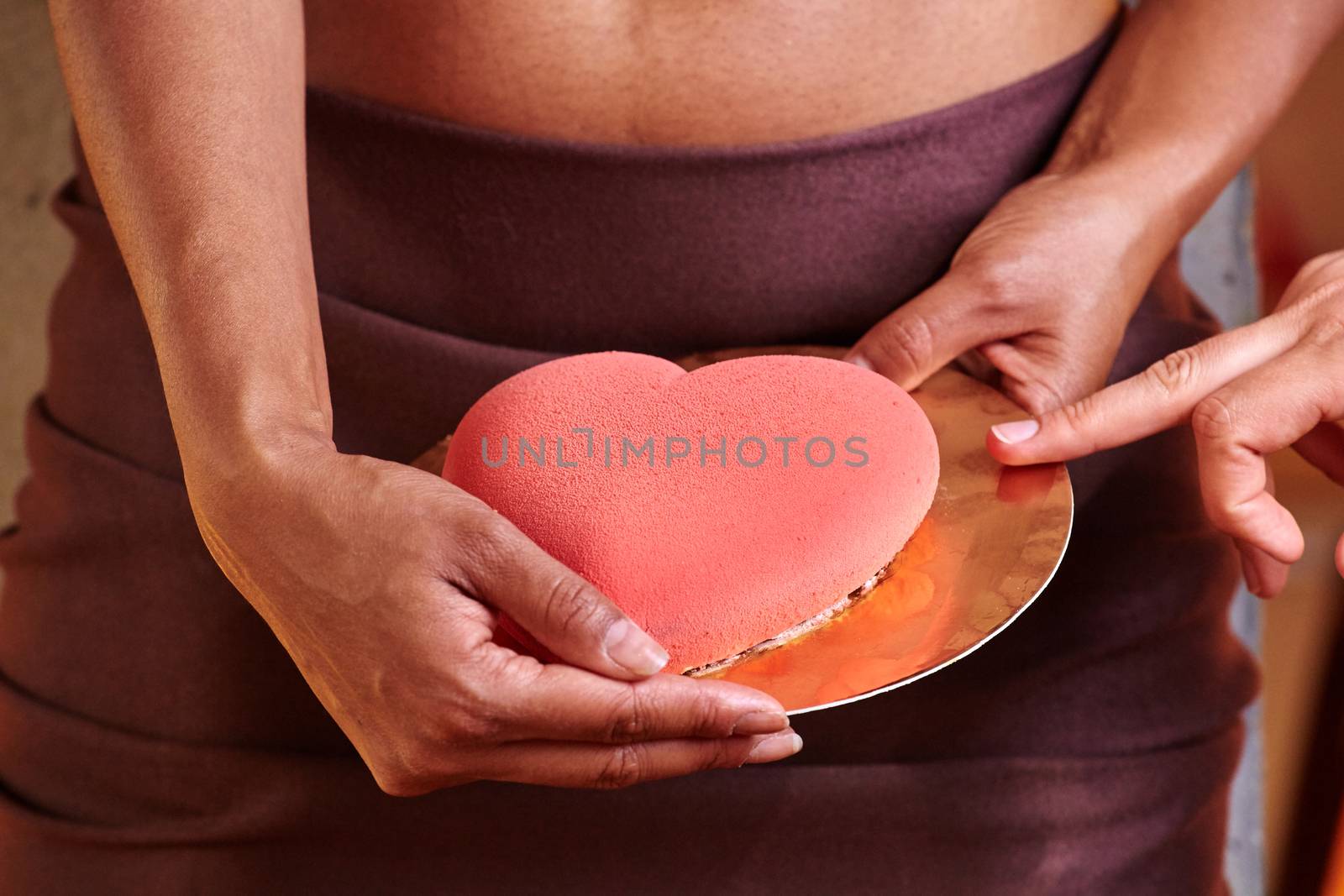 Dessert in hand at level of the abdomen. by sarymsakov