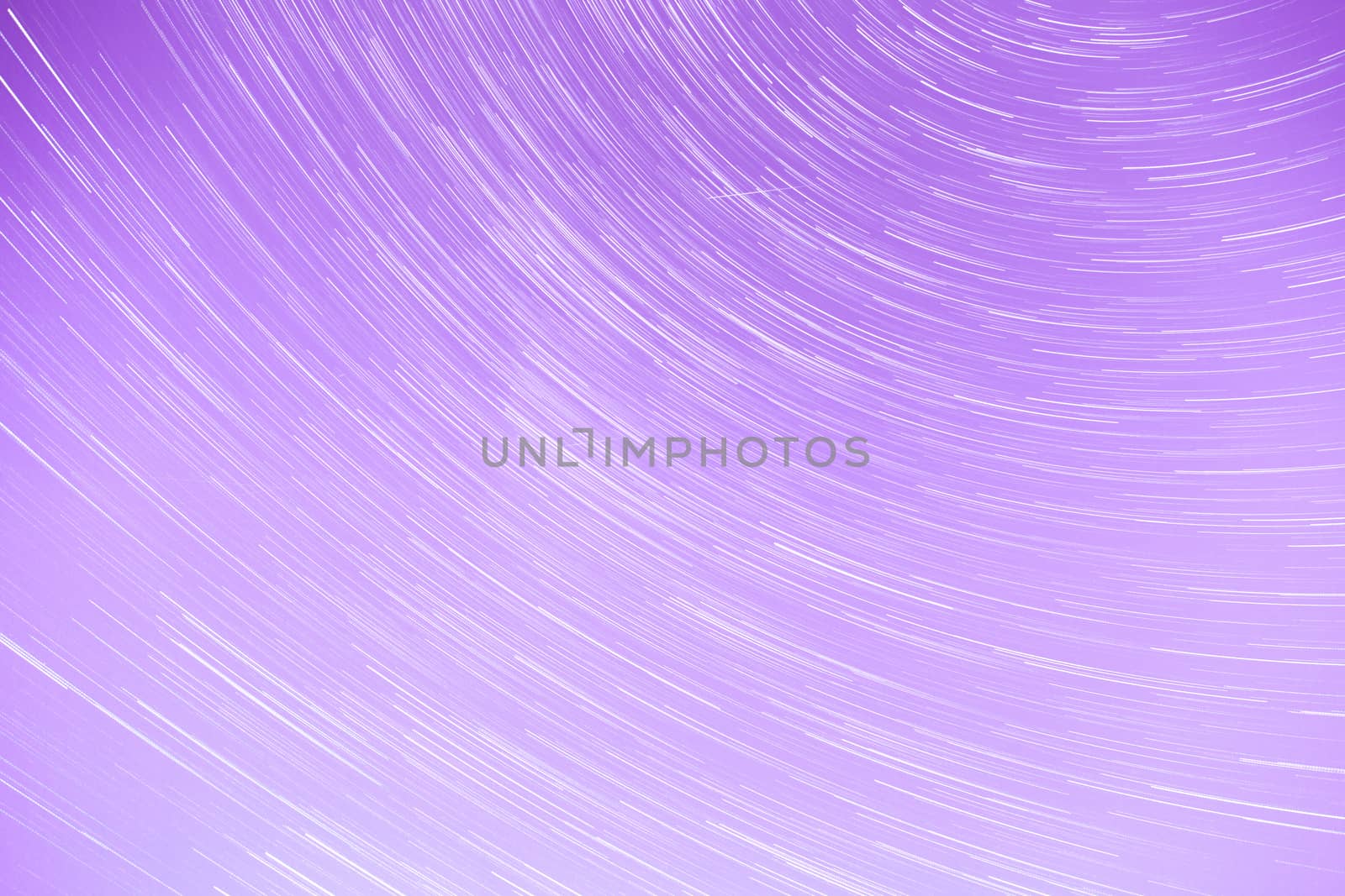 Star Trails streaking across a Purple Sky.