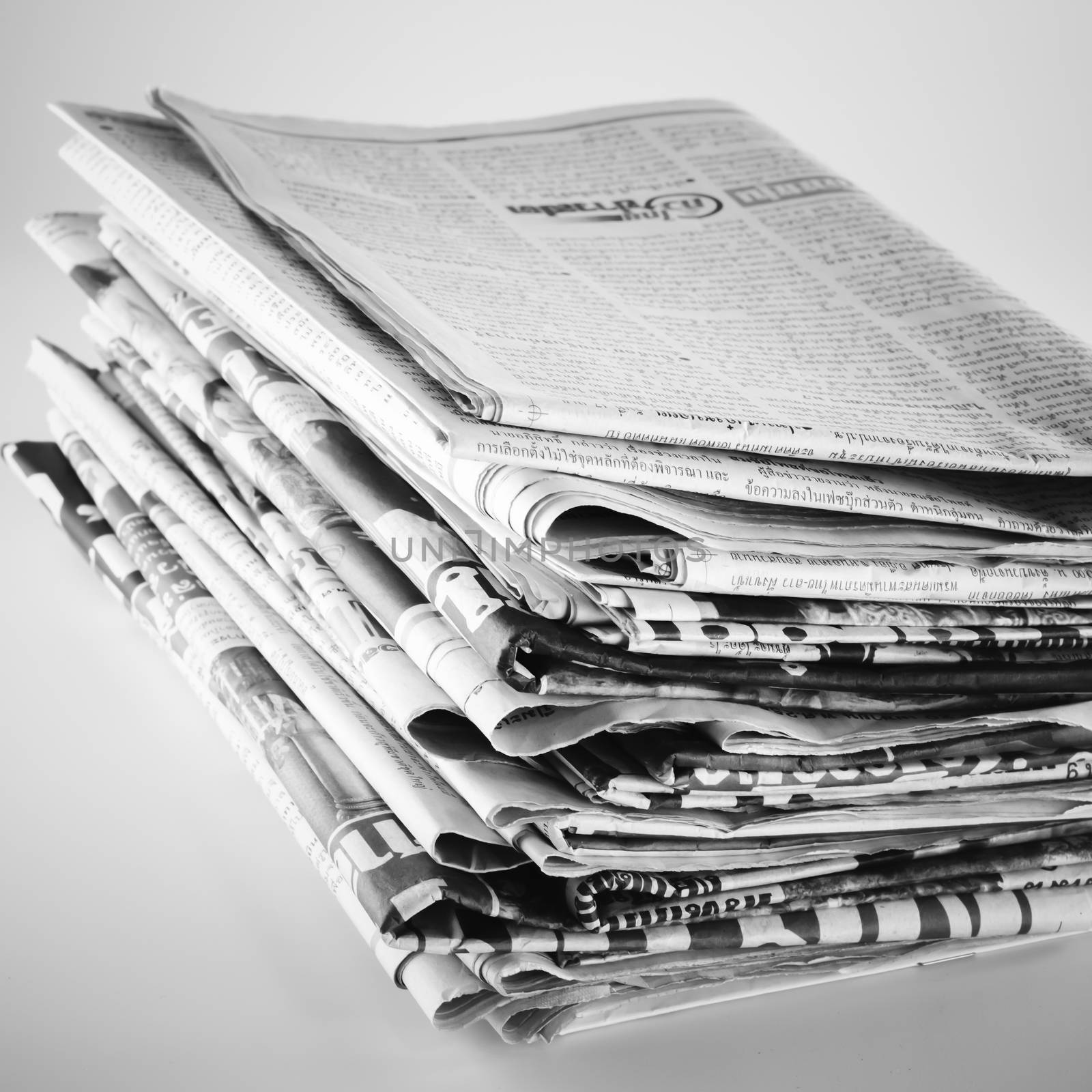 stack of newspaper black and white color tone style by ammza12