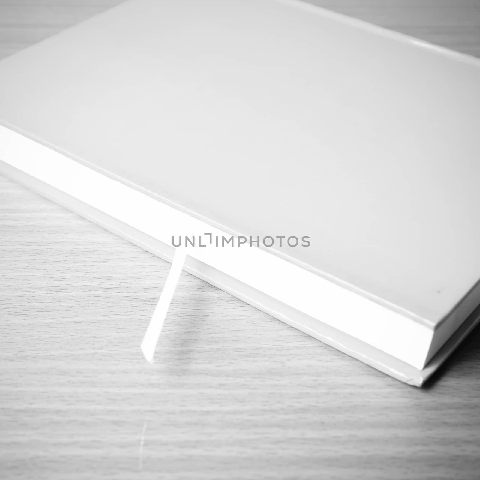 book on wood table background black and white color tone style