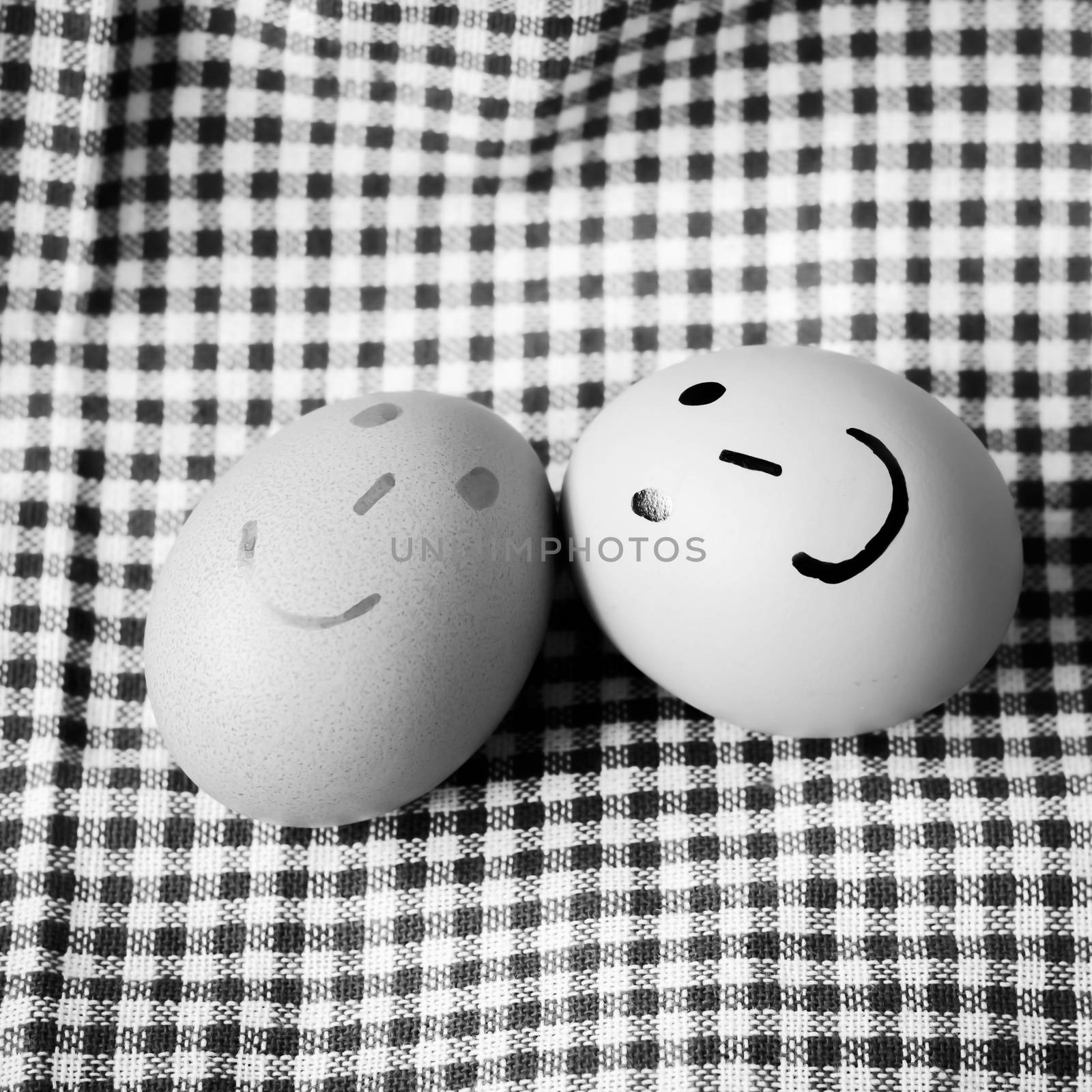 smile love egg couple in brown kitchen towel on wood table black and white color tone style
